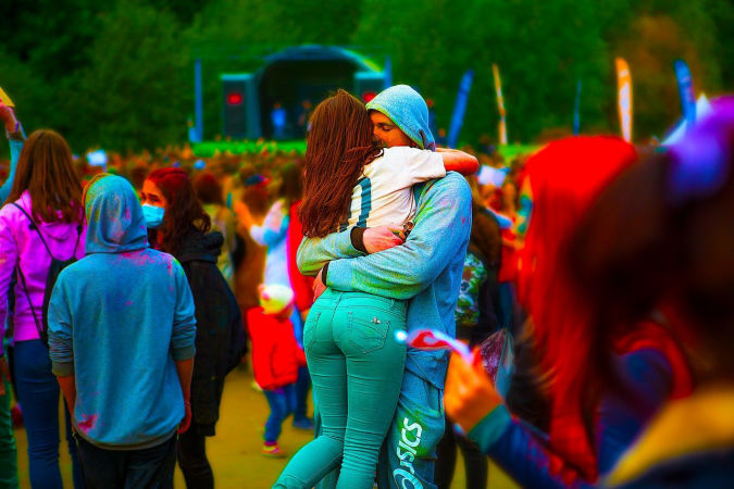 A-man-and-a-woman-at-a-colourful-festival